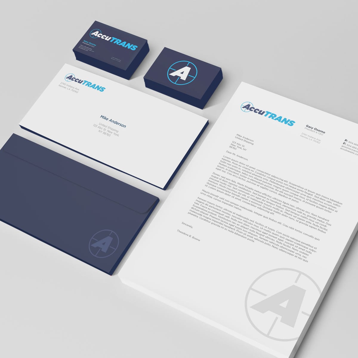 AccuTRANS business cards, letterhead and envelope in navy and white