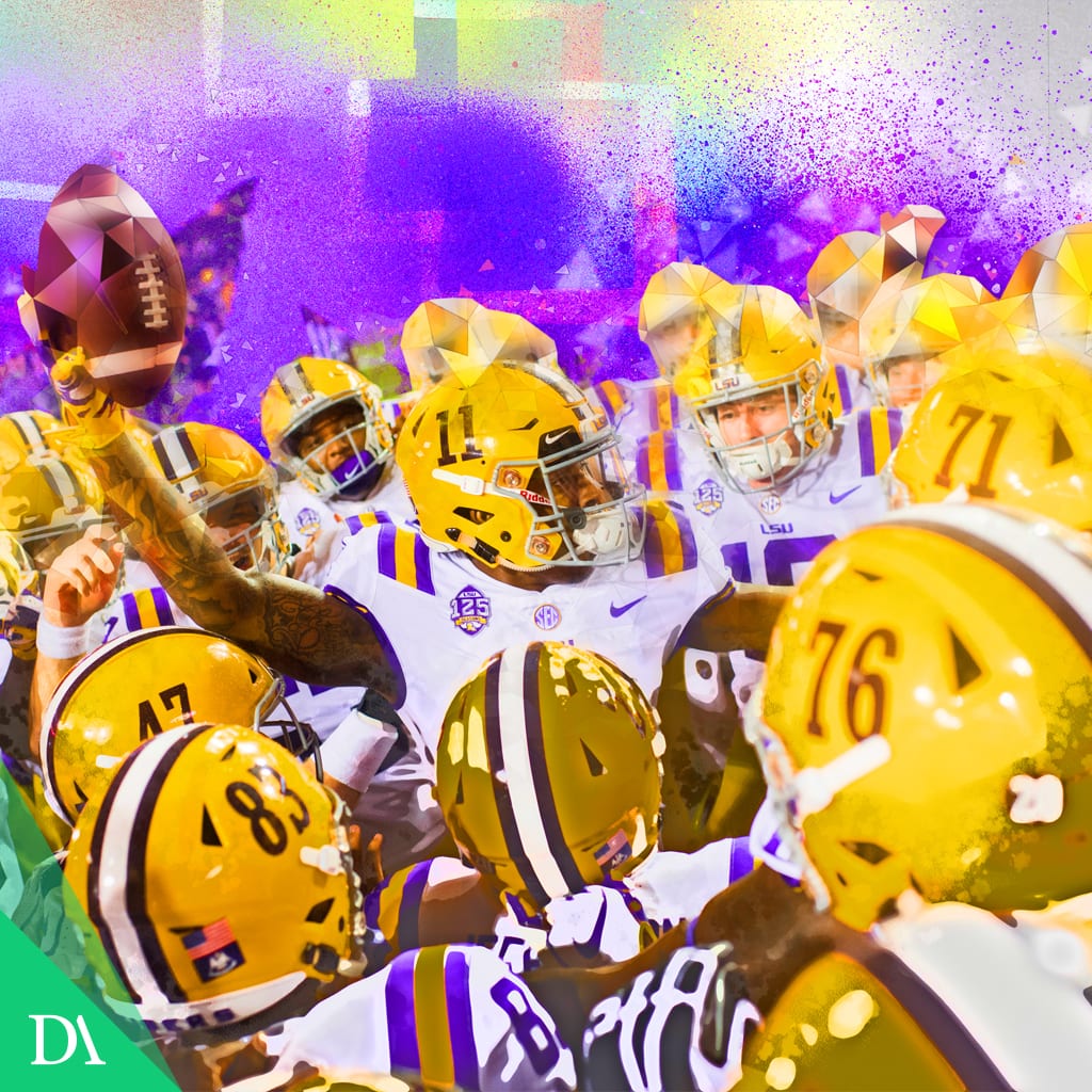 LSU football players in gold helmets huddled in a burst of purple and gold